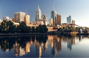 View of Melbourne city skyline on sunny day from across the Yarra River