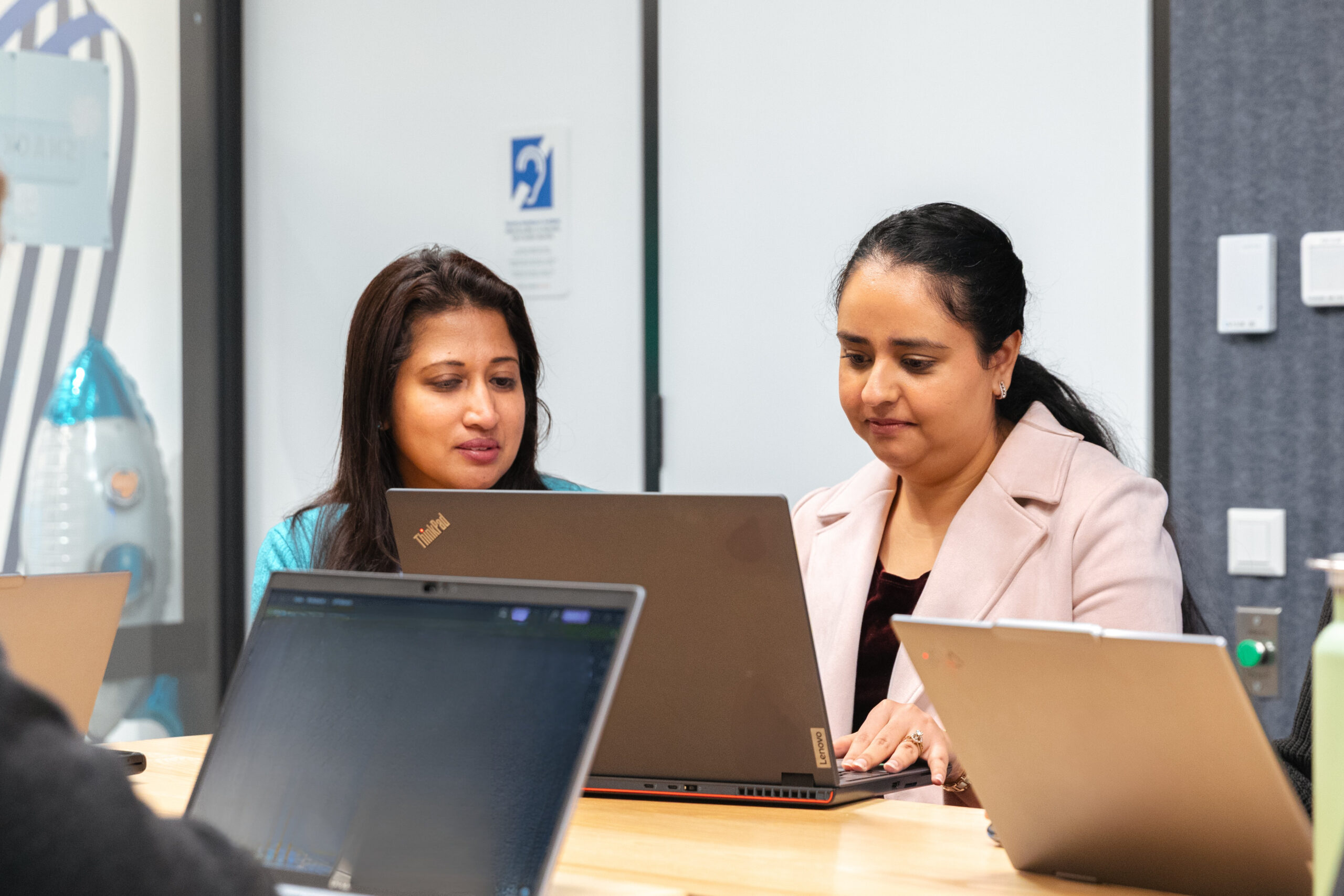 People collaborating in SERV's office
